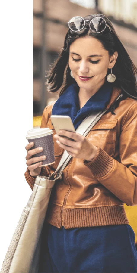 Woman drinking a coffee and using the YourParkingSpace app